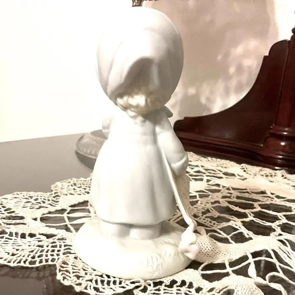 Vintage Precious Moments March Birthday Month figurine.
